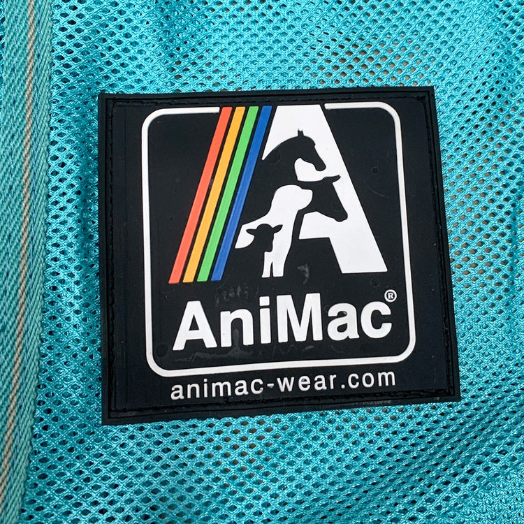 A square patch with the AniMac logo—silhouettes of a horse, sheep, and cow inside a rainbow-striped A—on turquoise mesh. Text: AniMac and animac-wear.com. Ideal for fans of the Allrounder Fly Rug Combo by AniMac.