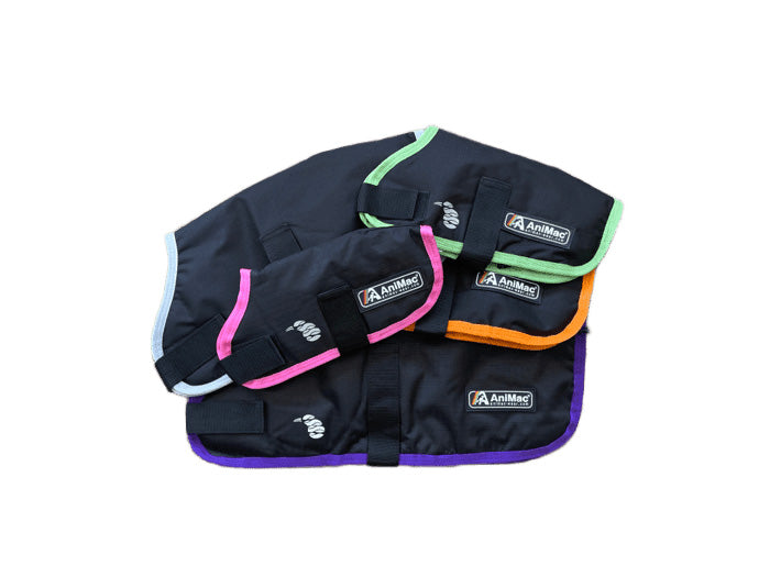 Four AniMac brand Lamb Coat | Waterproof jackets in black with green, pink, orange, and purple trims are stacked on a white background. Each coat combines style and protection for your flock.