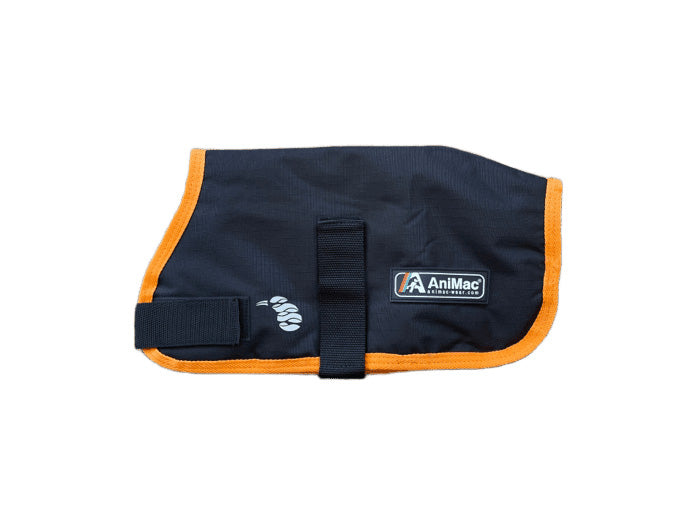 The Alpaca Coat | Waterproof, in black with bright orange trim, features a velcro strap and AniMac logo patch on the side. It is displayed laid flat on a white background.