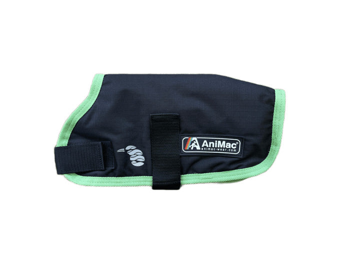 The Alpaca Coat | Waterproof in black and green features a velcro strap and AniMac logo patch on the side, shown against a white background.